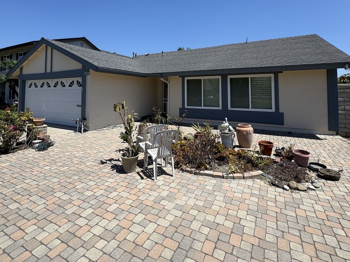 After: exterior repaint complete with fresh slate-blue trim