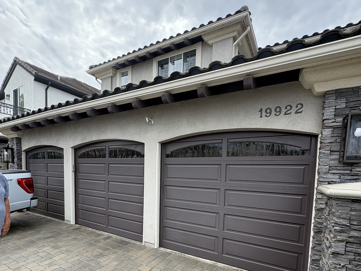 Before: original dark brown garage doors