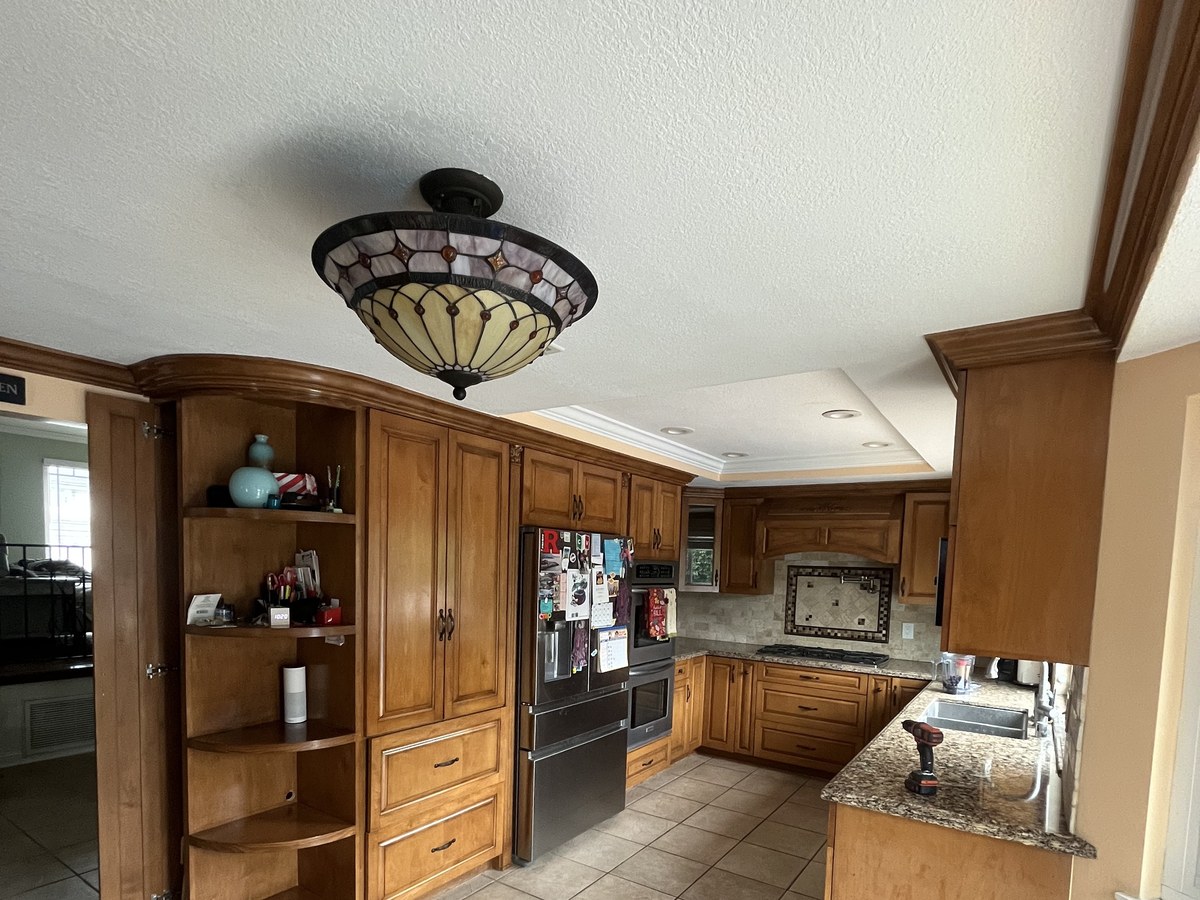 Before: original stained wood built-in cabinetry