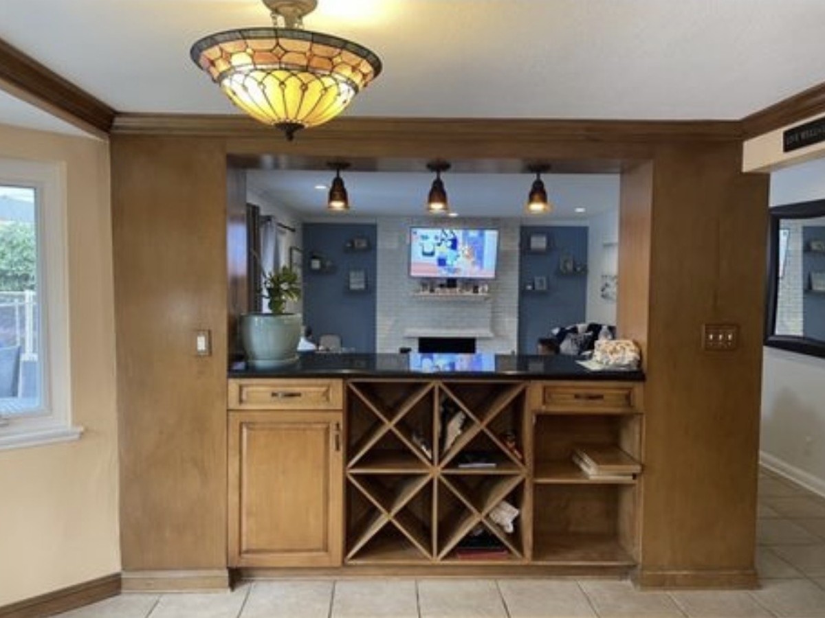 Before: original wood-toned wet bar cabinetry