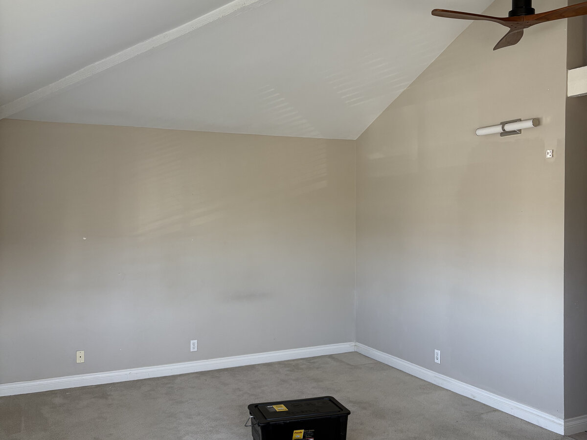 Before: plain taupe bedroom wall