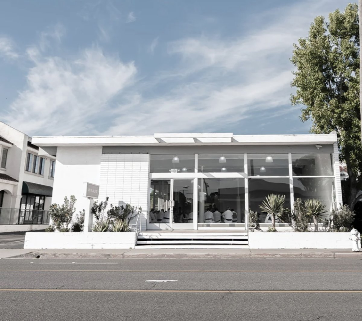Commercial building exterior repainted bright white