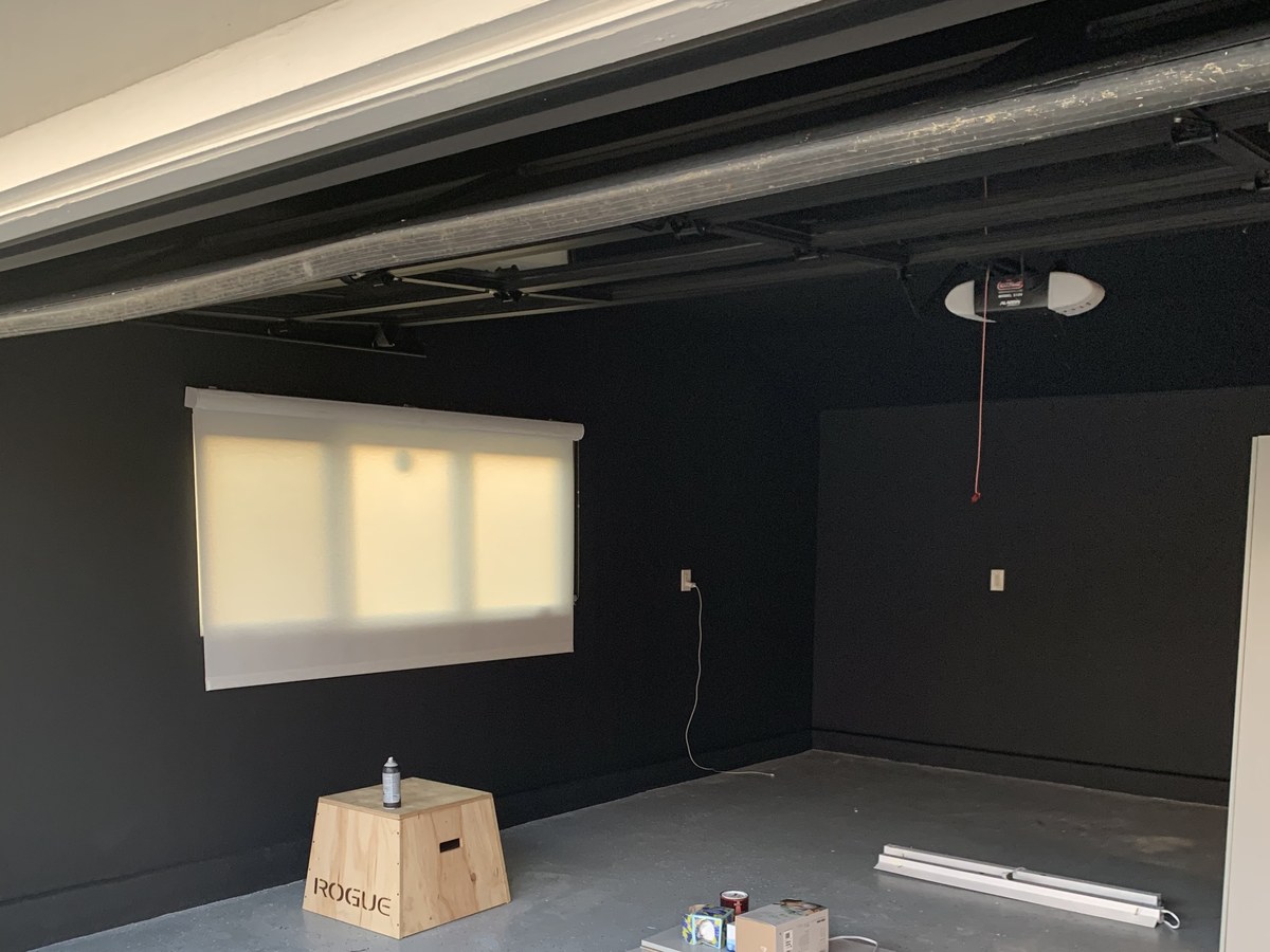 Garage mid-project with walls freshly painted black