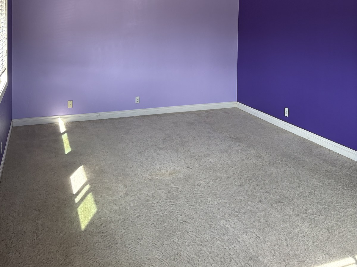 Before: bedroom walls in a bold two-tone purple